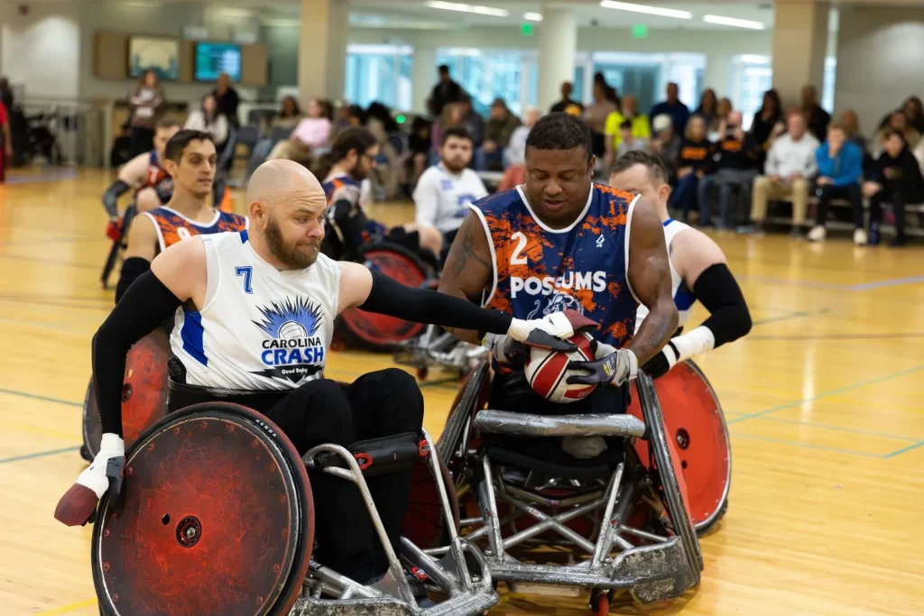 man trying to steal ball from other player wheel chair rugby man trying to steal ball from an other player in wheel chair rugby