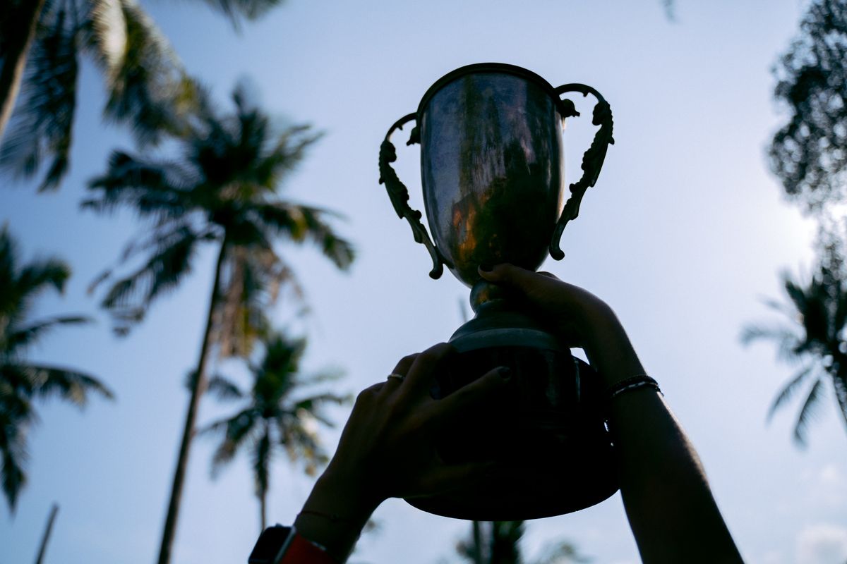 Champions raising a trophy